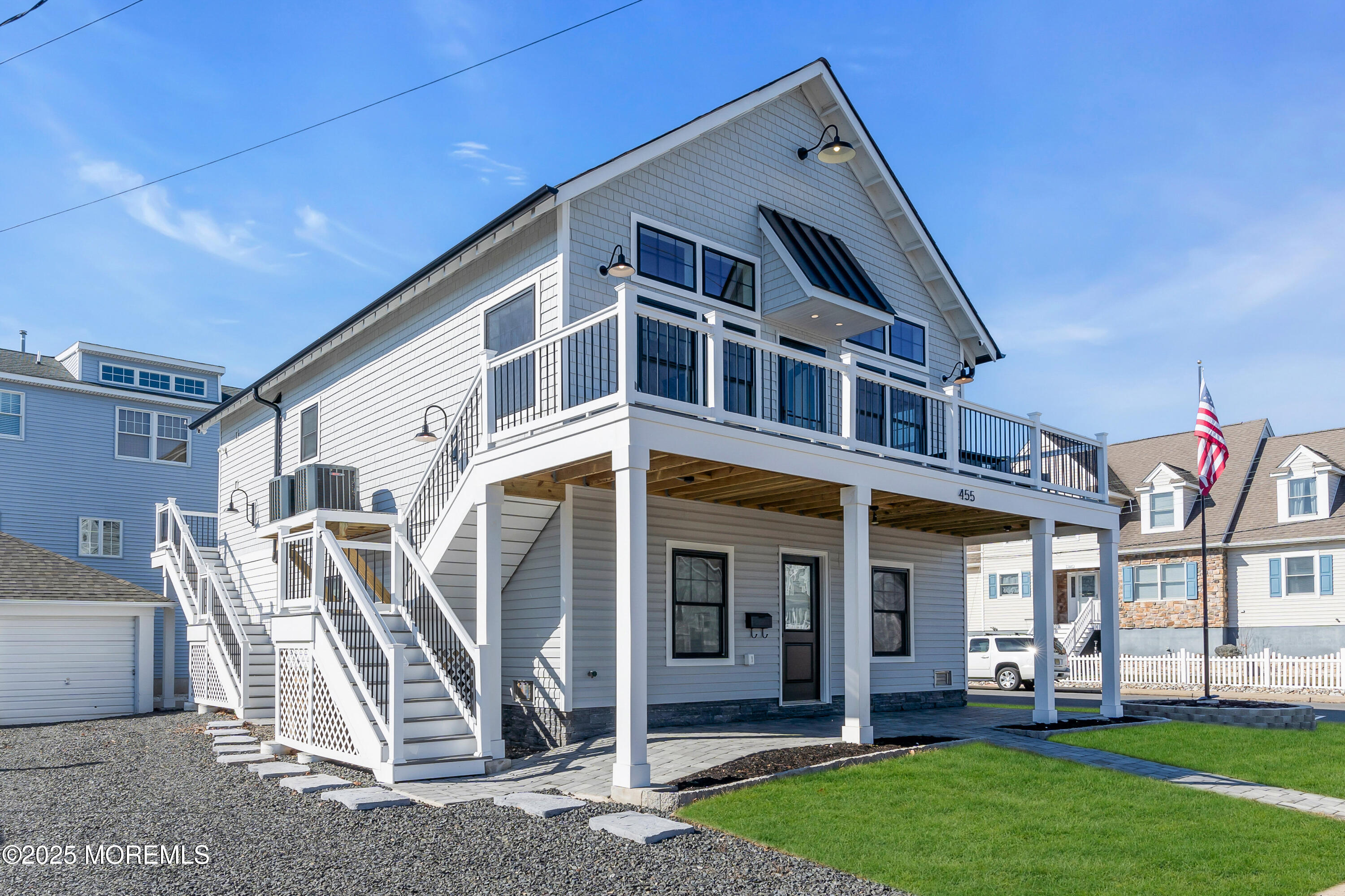 455 East Main Street Manasquan, NJ 08736 - Photo 7 of 47 a front view of a house with a yard