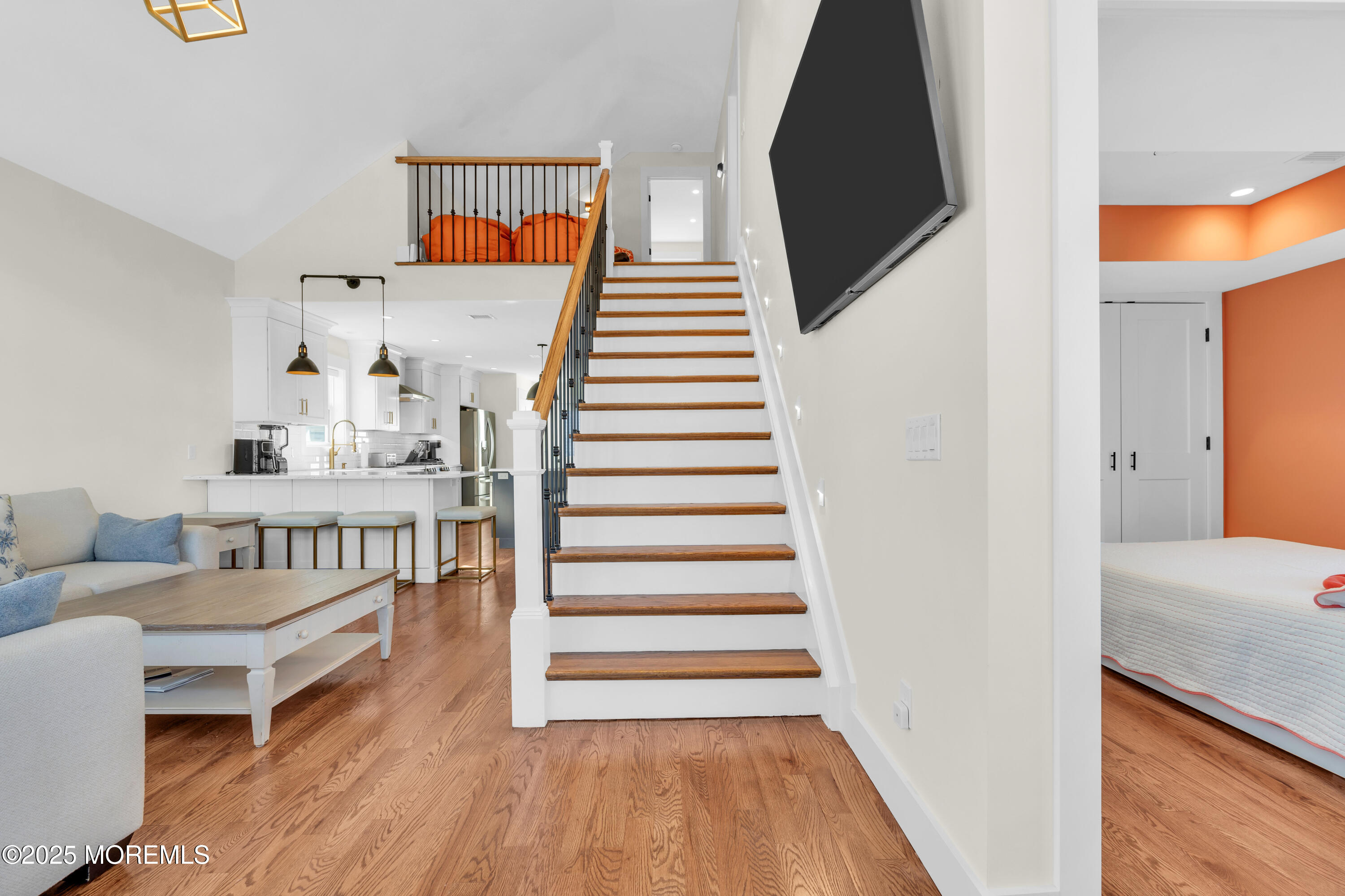 455 East Main Street Manasquan, NJ 08736 - Photo 10 of 47 a view of a bedroom with wooden floor and stairs