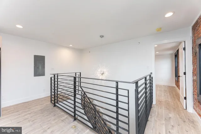 a view of entryway with wooden floor