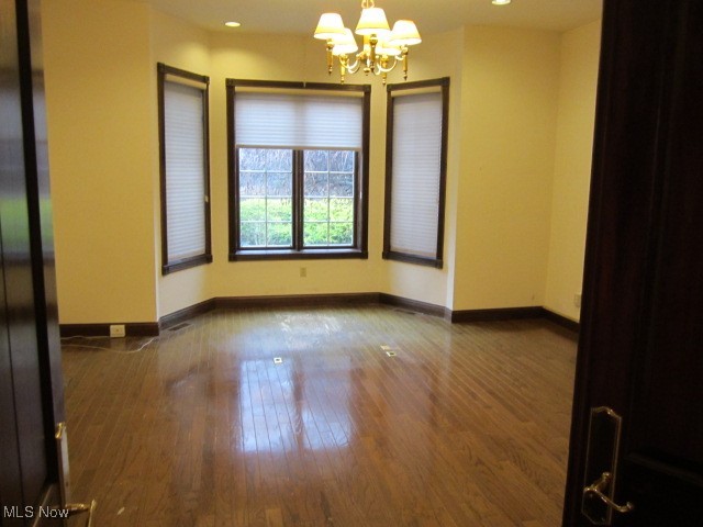 6999 Gates Road Gates Mills, OH 44040 - Photo 20 of 20 Empty room featuring a chandelier, dark wood-style flooring, and recessed lighting