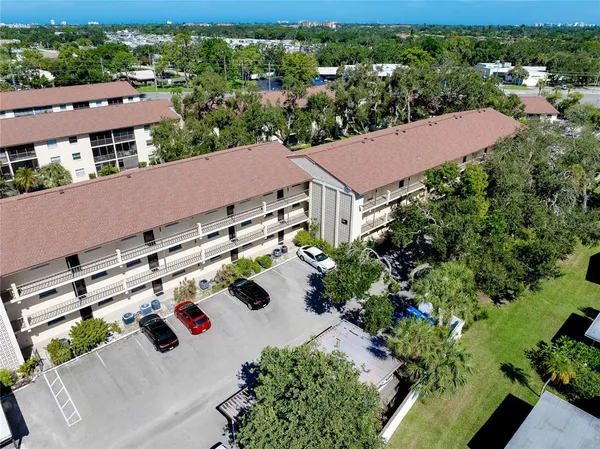 an aerial view of house with yard
