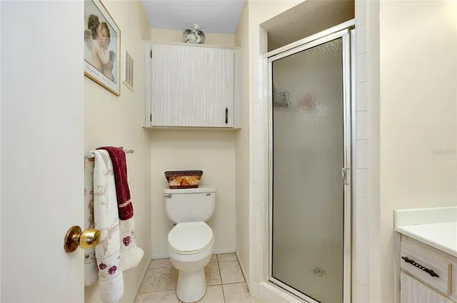 a white toilet sitting next to a bathroom sink