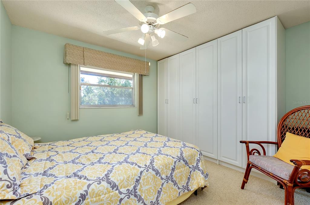 2280 Stickney Point Road, Unit 432 Sarasota, FL 34231 - Photo 22 of 35 a bedroom with a bed and a window