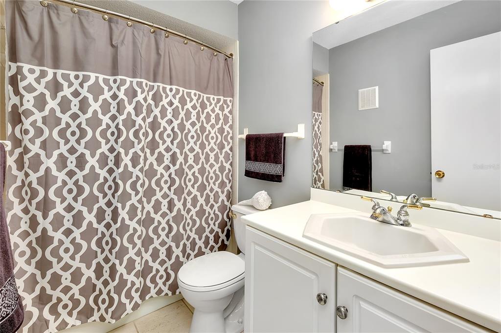 2280 Stickney Point Road, Unit 432 Sarasota, FL 34231 - Photo 24 of 35 a bathroom with a sink and a mirror