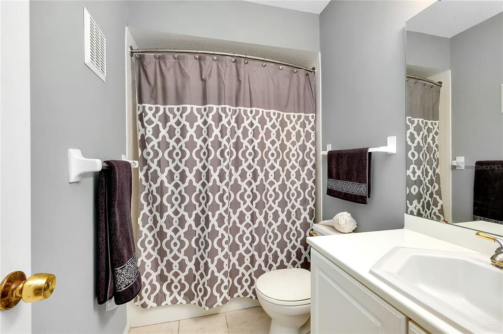 2280 Stickney Point Road, Unit 432 Sarasota, FL 34231 - Photo 25 of 35 a bathroom with a sink toilet and shower