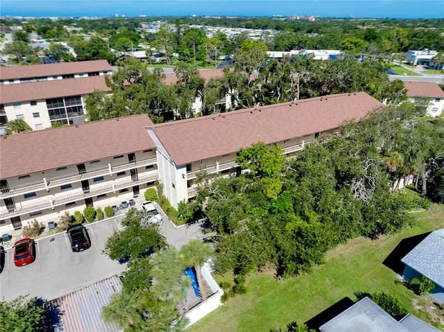 an aerial view of a house with a garden