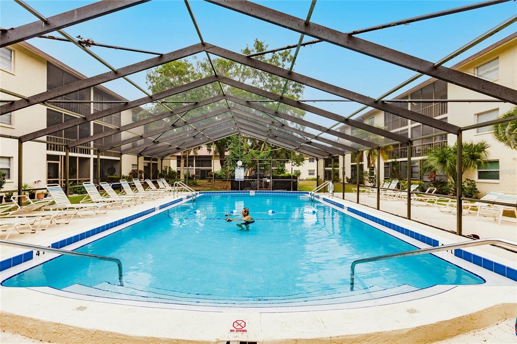 2280 Stickney Point Road, Unit 432 Sarasota, FL 34231 - Photo 31 of 35 a view of a swimming pool with a porch
