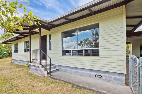 a house view with a backyard space