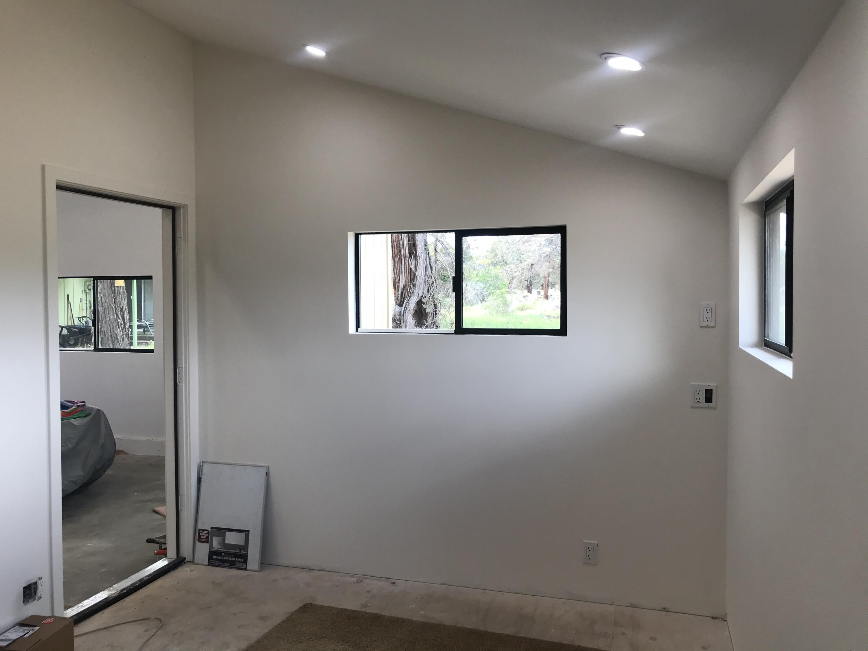 22980 McGrath Road Bend, OR 97701 - Photo 5 of 23 an empty room with windows