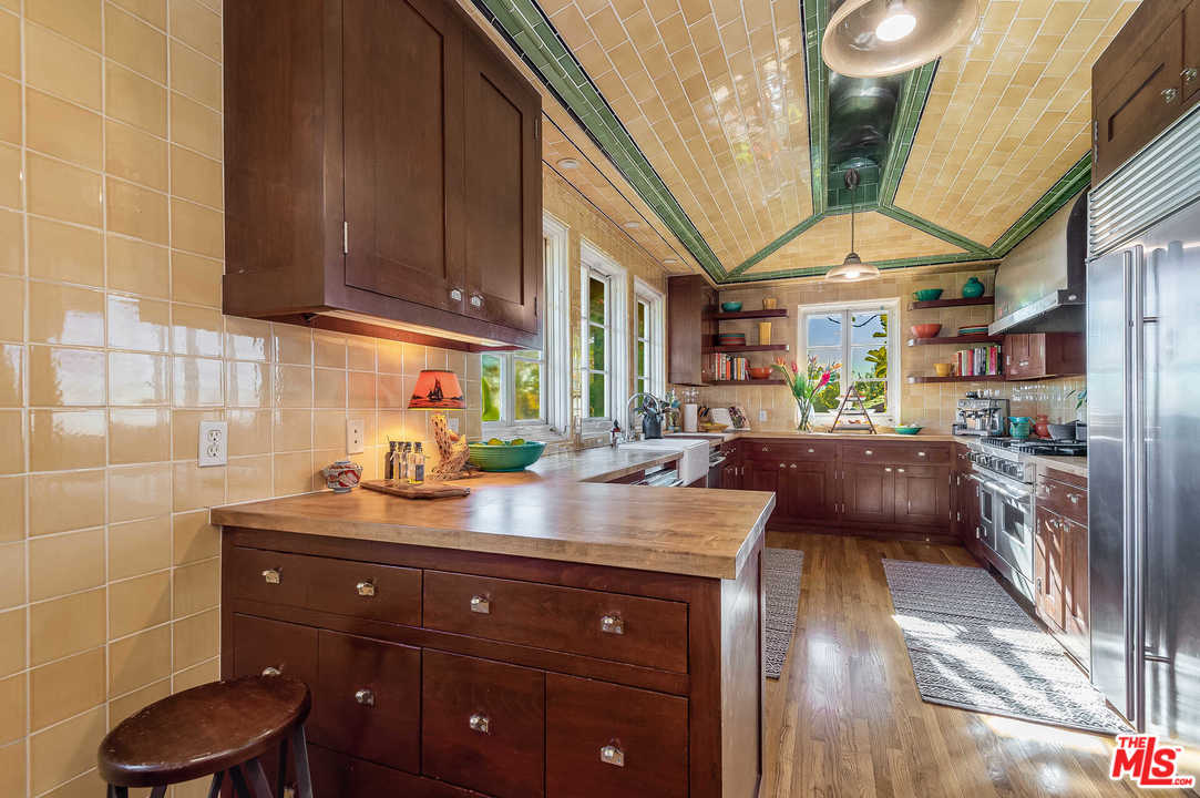 2318 Hollyridge Drive Los Angeles, CA 90068 - Photo 12 of 40 a kitchen with a sink and cabinets