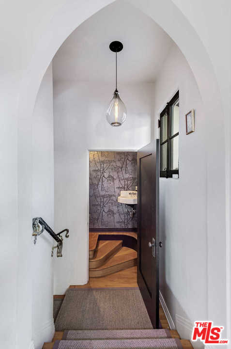 2318 Hollyridge Drive Los Angeles, CA 90068 - Photo 14 of 40 a picture of a glass door with a chandelier