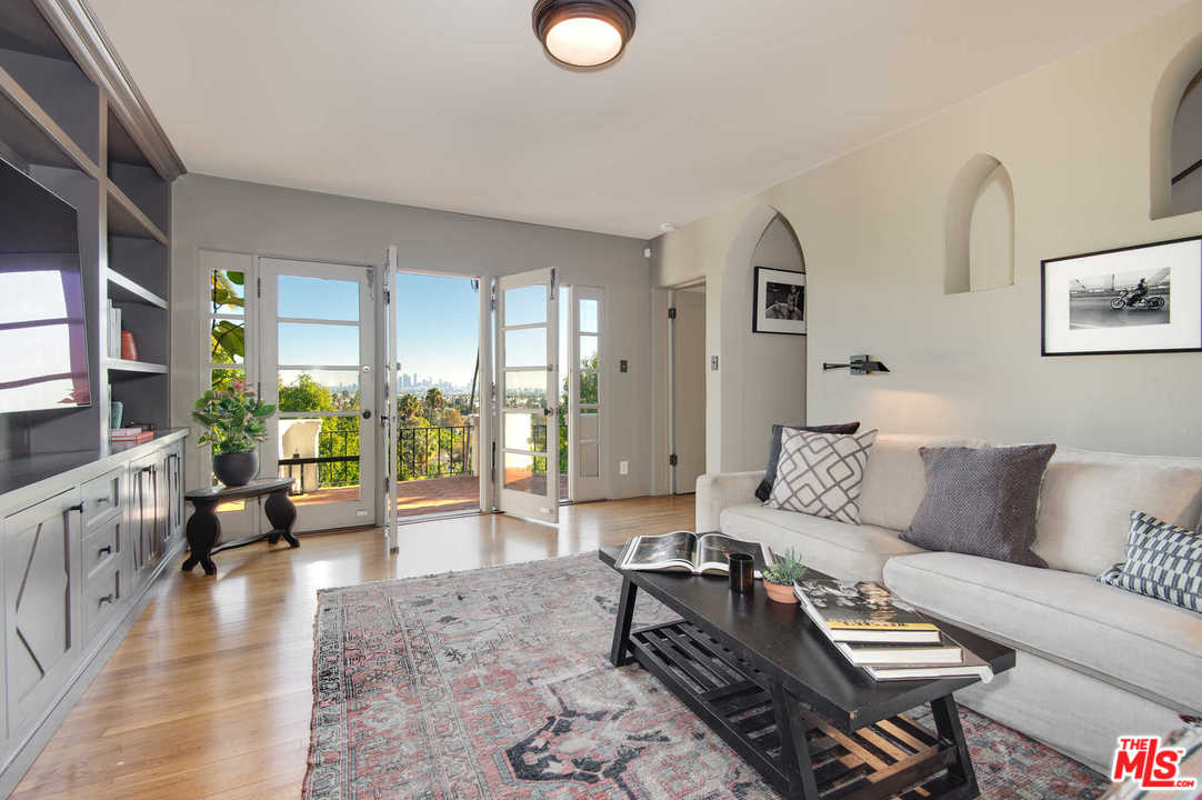 2318 Hollyridge Drive Los Angeles, CA 90068 - Photo 15 of 40 a living room with furniture and a large window