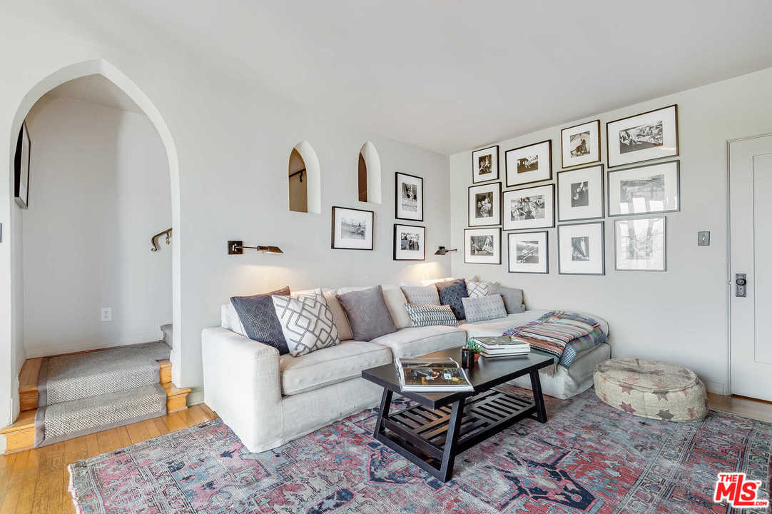 2318 Hollyridge Drive Los Angeles, CA 90068 - Photo 16 of 40 a living room with furniture and painting on the wall