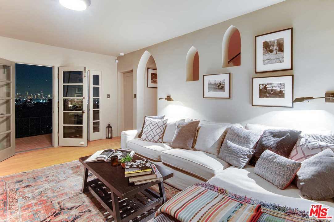 2318 Hollyridge Drive Los Angeles, CA 90068 - Photo 18 of 40 a living room with furniture and a window