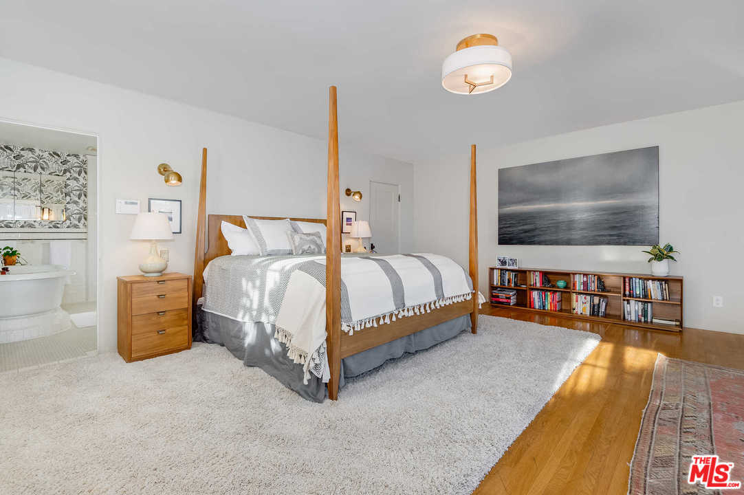 2318 Hollyridge Drive Los Angeles, CA 90068 - Photo 20 of 40 a bedroom with bed and a flat tv screen on dresser