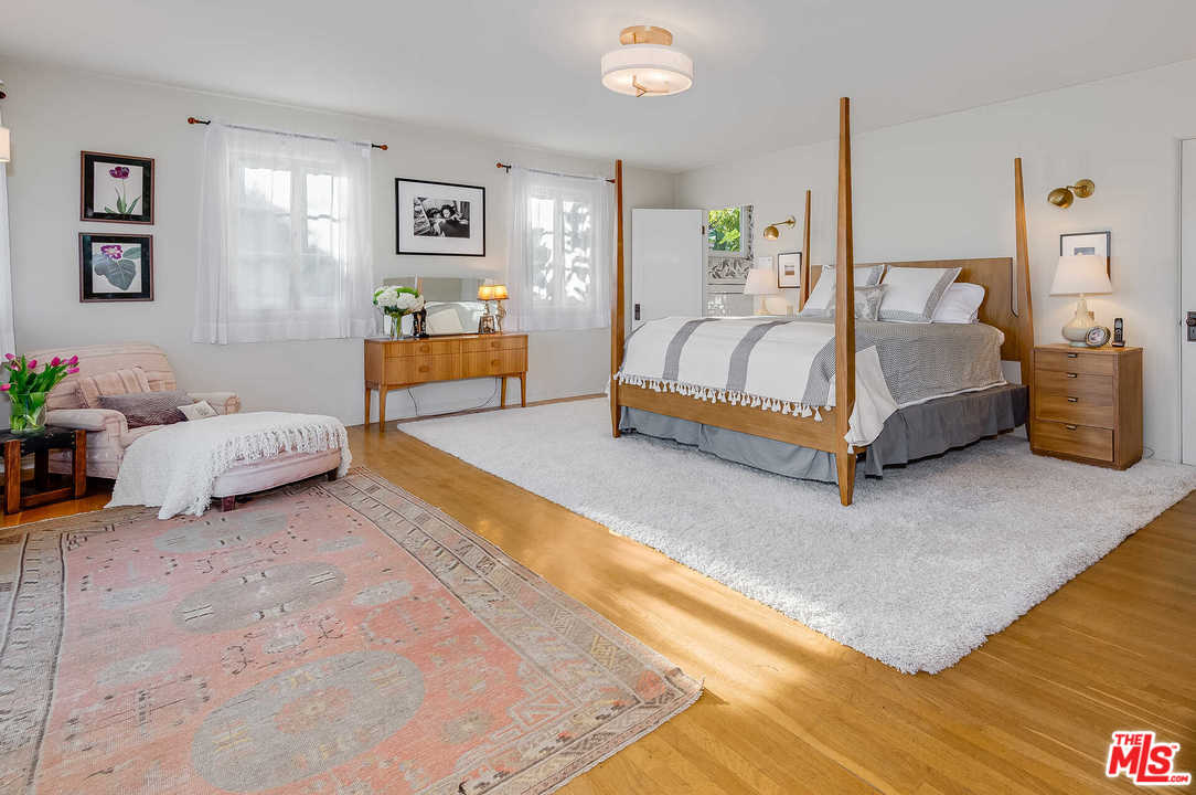 2318 Hollyridge Drive Los Angeles, CA 90068 - Photo 21 of 40 a spacious bedroom with a bed and window