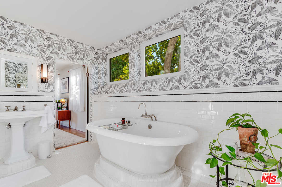 2318 Hollyridge Drive Los Angeles, CA 90068 - Photo 22 of 40 a bath room with a sink and a mirror