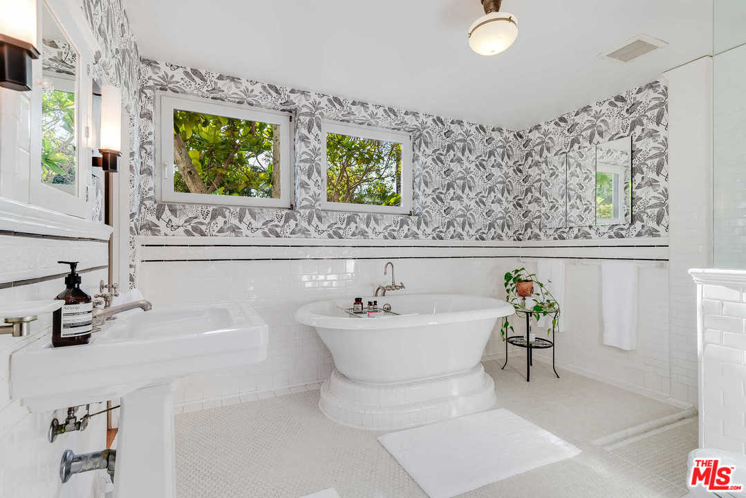 2318 Hollyridge Drive Los Angeles, CA 90068 - Photo 23 of 40 a bathroom with a sink and a mirror