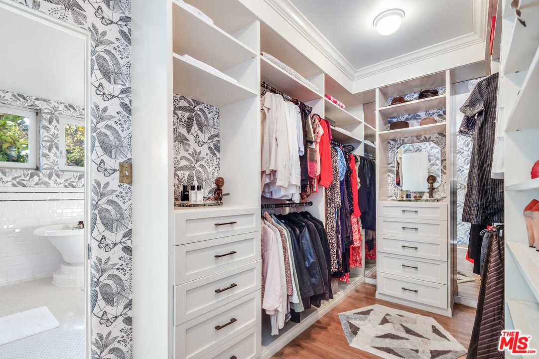 2318 Hollyridge Drive Los Angeles, CA 90068 - Photo 25 of 40 a view of walk in closet with clothes and shoes
