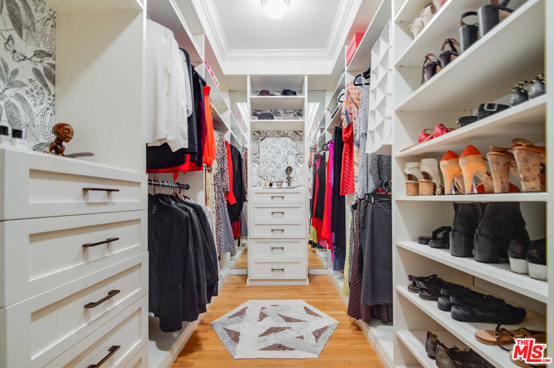 2318 Hollyridge Drive Los Angeles, CA 90068 - Photo 26 of 40 a view of walk in closet with clothes and shoes
