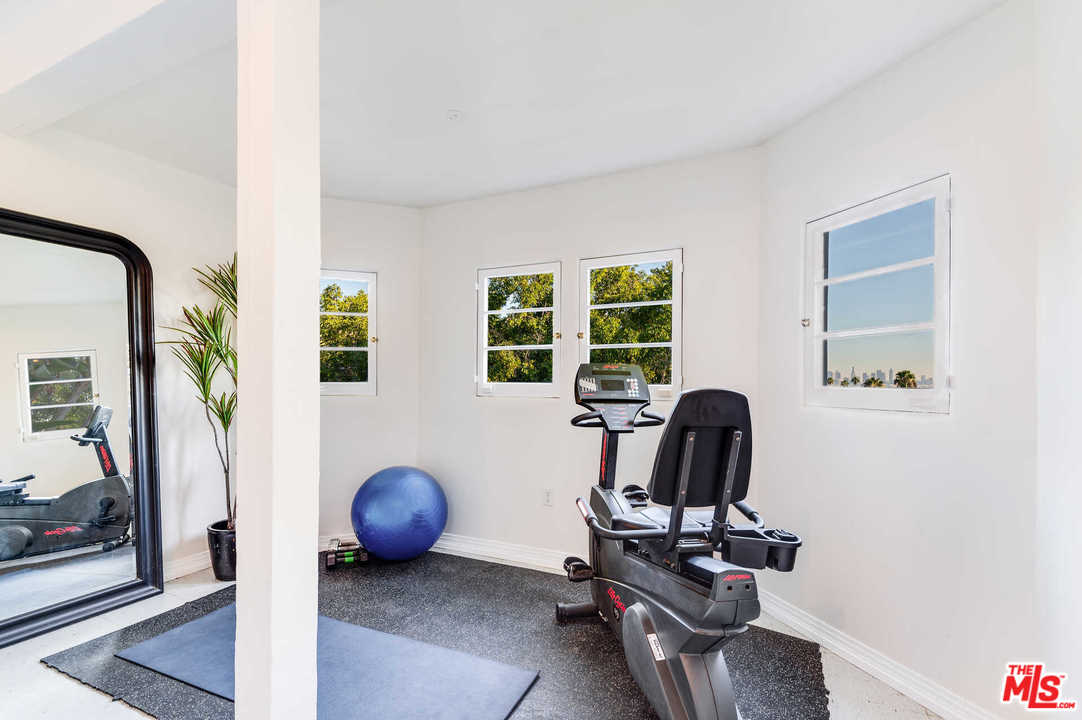 2318 Hollyridge Drive Los Angeles, CA 90068 - Photo 34 of 40 a view of a workspace with furniture and a window