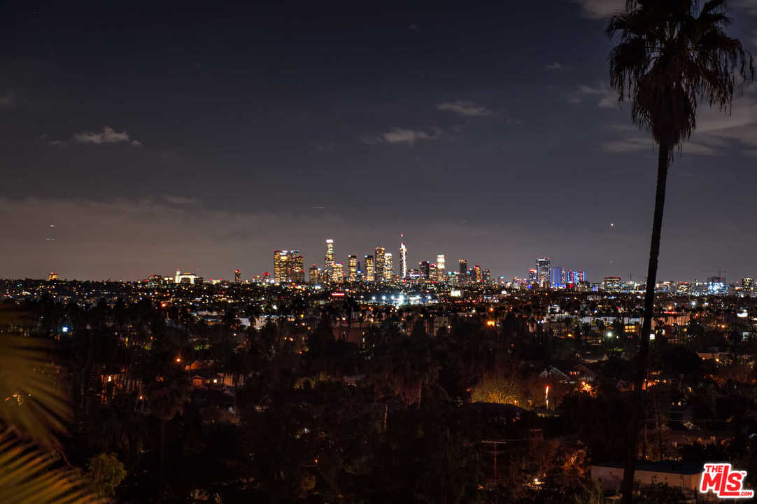2318 Hollyridge Drive Los Angeles, CA 90068 - Photo 39 of 40 a view of a lot of trees and cars parked in a yard