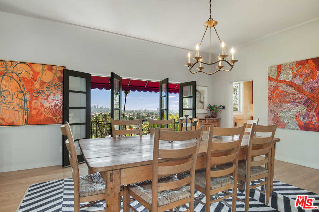 2318 Hollyridge Drive Los Angeles, CA 90068 - Photo 10 of 40 a view of a dining room with furniture window and outside view
