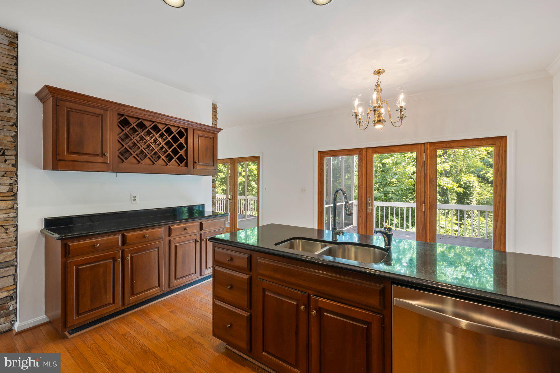 370 South River Landing Road, Unit 370 Edgewater, MD 21037 - Photo 15 of 64 a kitchen with stainless steel appliances granite countertop a stove a sink and a cabinets