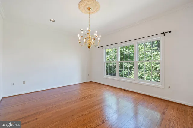 a view of room with window and hardwood floor