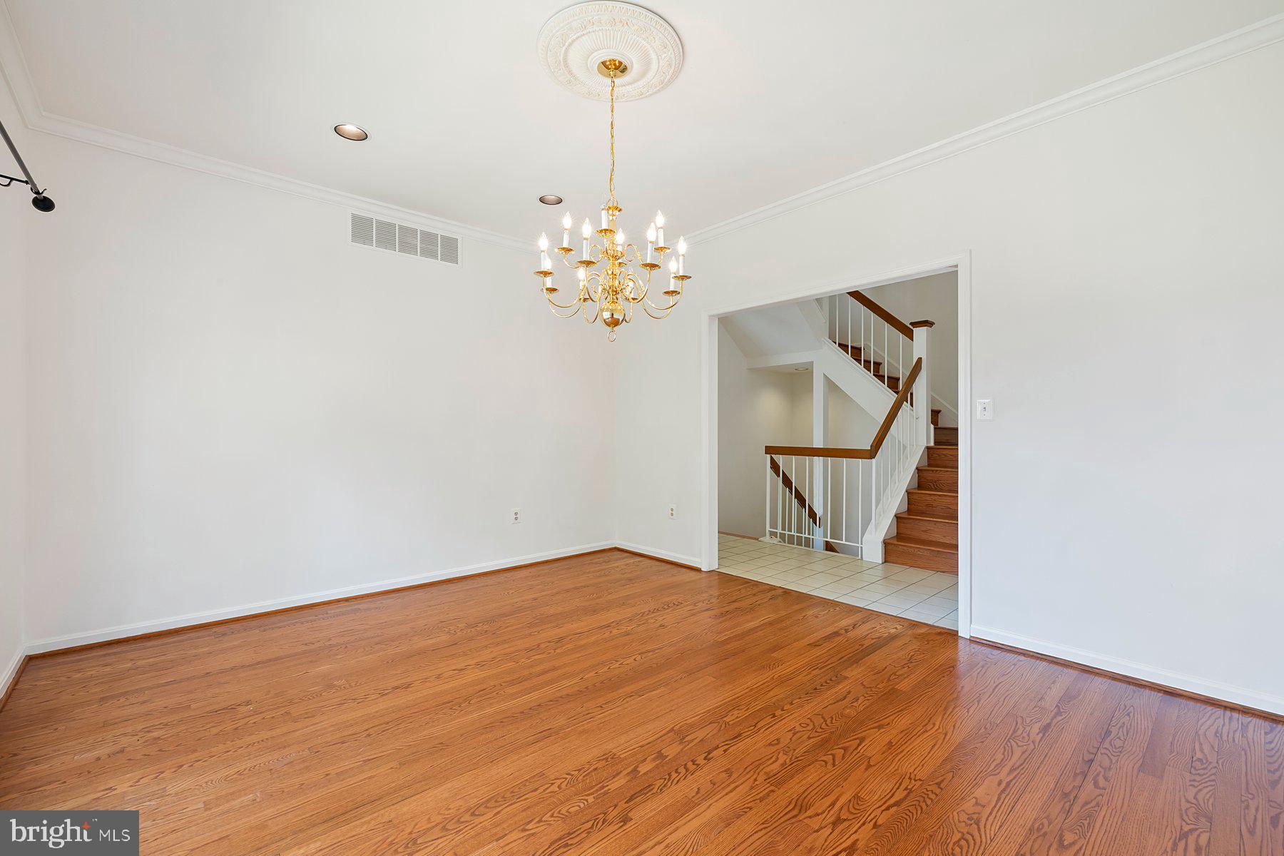 370 South River Landing Road, Unit 370 Edgewater, MD 21037 - Photo 18 of 64 a view of a hallway with wooden floor and a chandelier