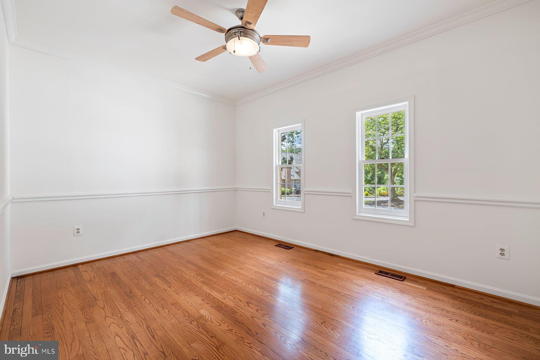 370 South River Landing Road, Unit 370 Edgewater, MD 21037 - Photo 19 of 64 an empty room with wooden floor fan and windows