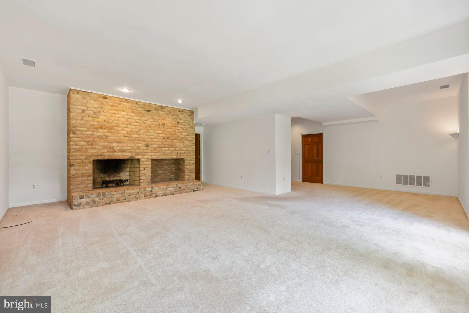 370 South River Landing Road, Unit 370 Edgewater, MD 21037 - Photo 34 of 64 a view of an empty room with a fireplace and a window