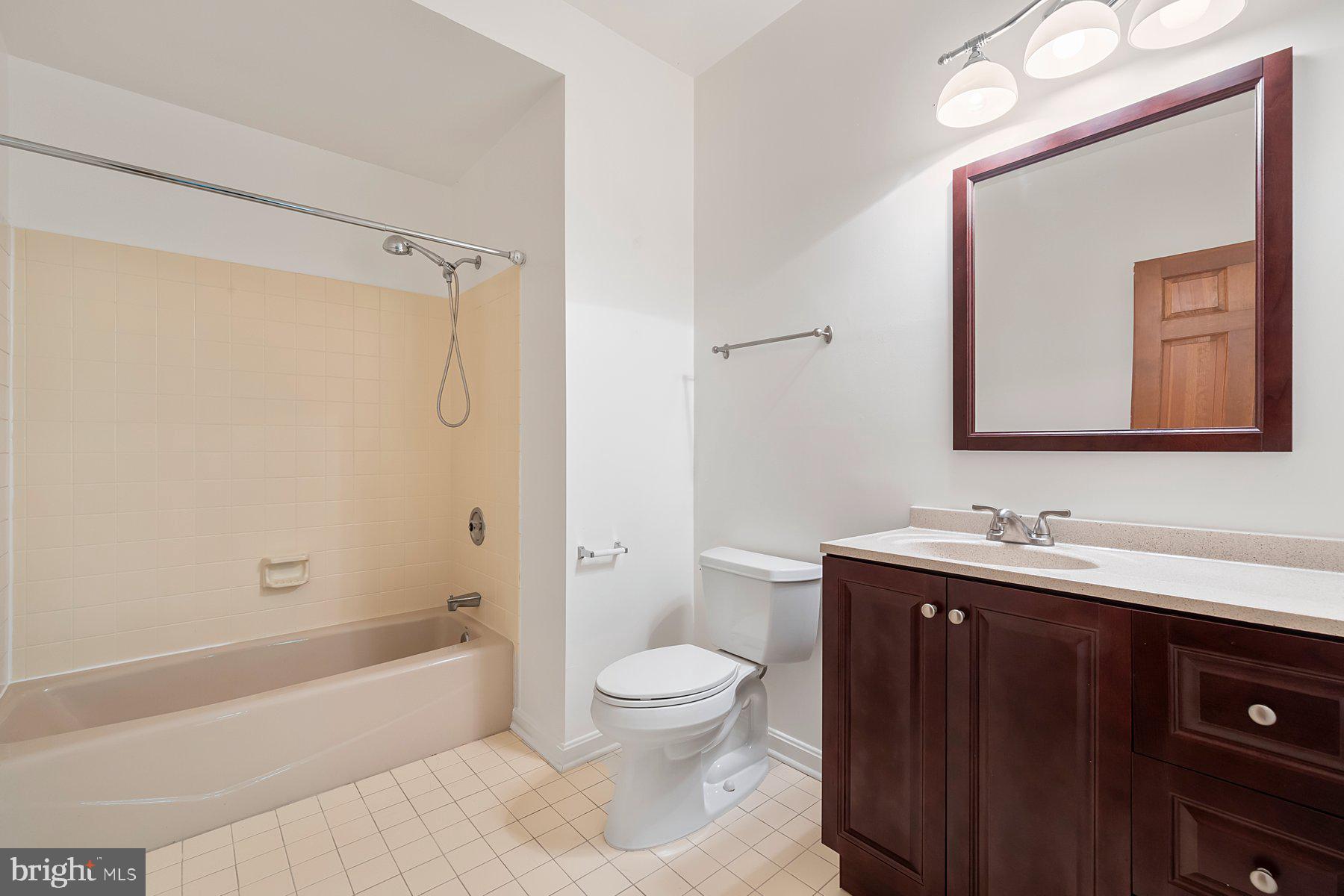 370 South River Landing Road, Unit 370 Edgewater, MD 21037 - Photo 38 of 64 a bathroom with a toilet a sink and a bathtub