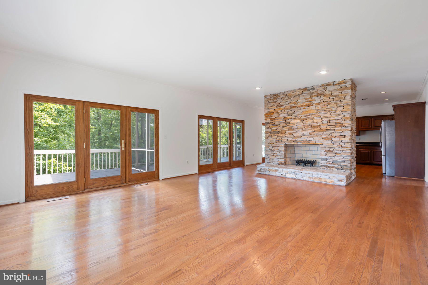 370 South River Landing Road, Unit 370 Edgewater, MD 21037 - Photo 7 of 64 a view of empty room with wooden floor and fireplace