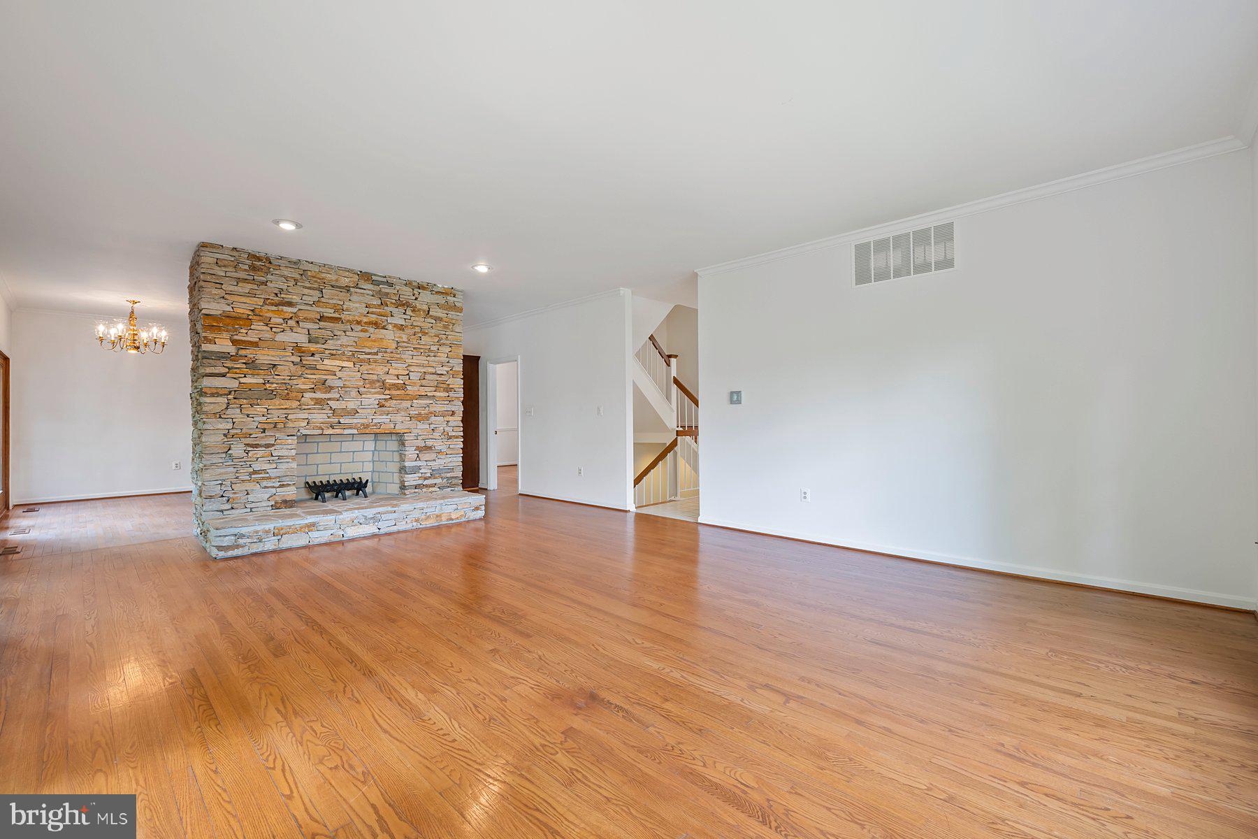 370 South River Landing Road, Unit 370 Edgewater, MD 21037 - Photo 8 of 64 a view of an empty room with wooden floor and a fireplace