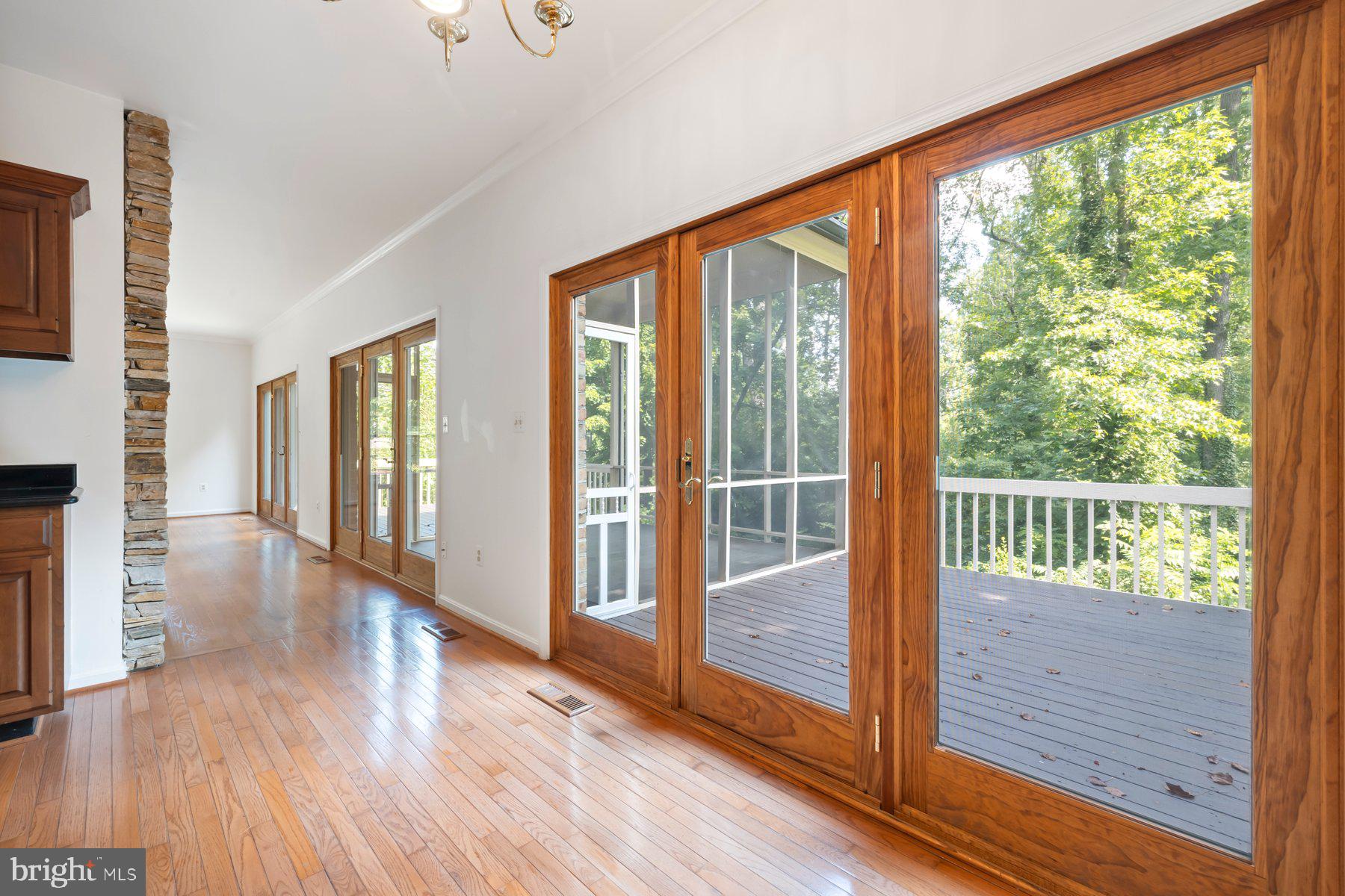 370 South River Landing Road, Unit 370 Edgewater, MD 21037 - Photo 10 of 64 a view of a porch with wooden floor and windows