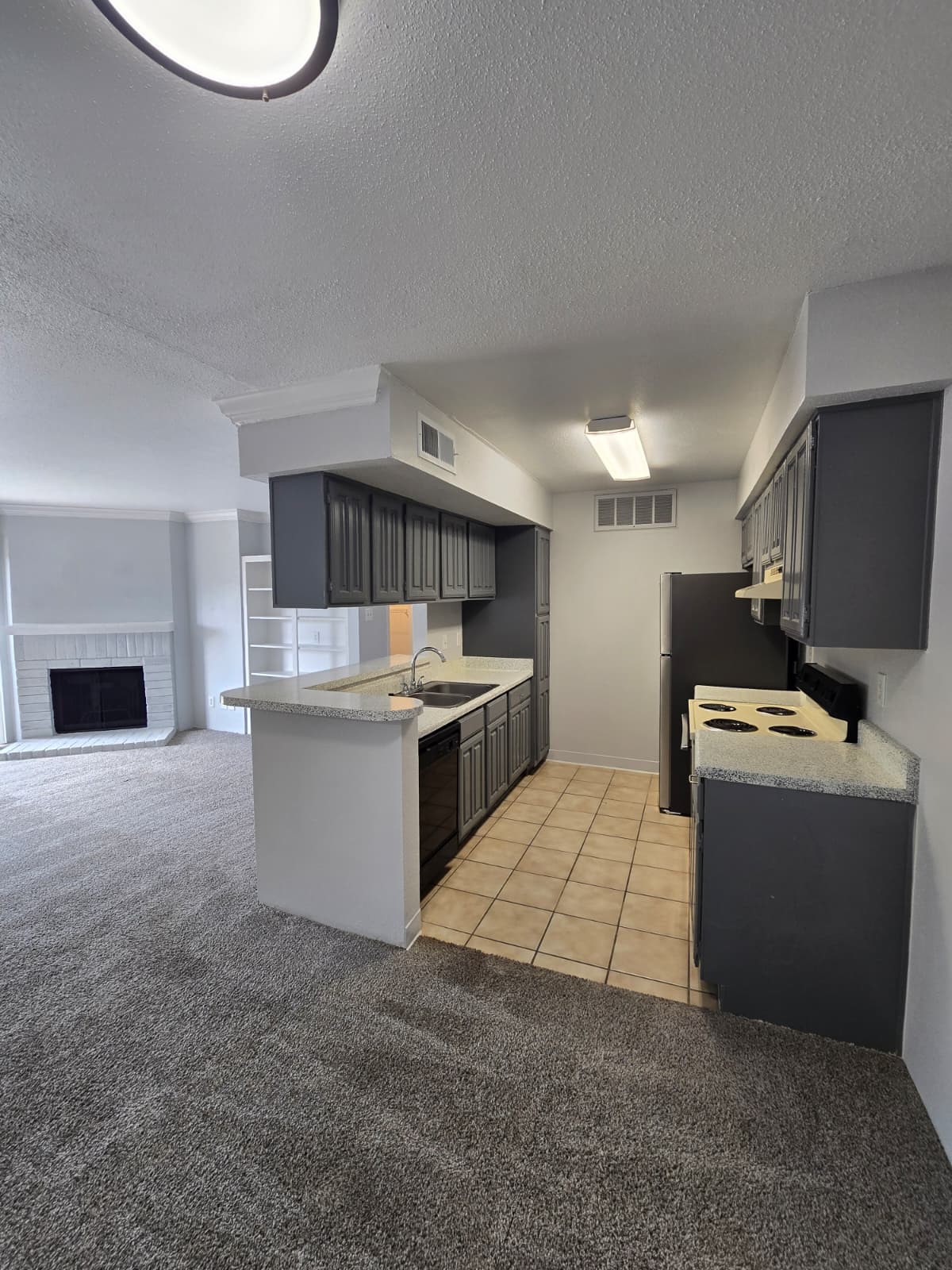 4747 Allendale Road, Unit 8 Houston, TX 77017 - Photo 1 of 11 a kitchen with kitchen island granite countertop a sink and a stove top oven
