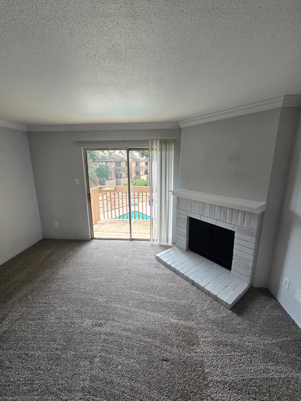 4747 Allendale Road, Unit 8 Houston, TX 77017 - Photo 5 of 11 a view of an empty room with a fireplace and a window
