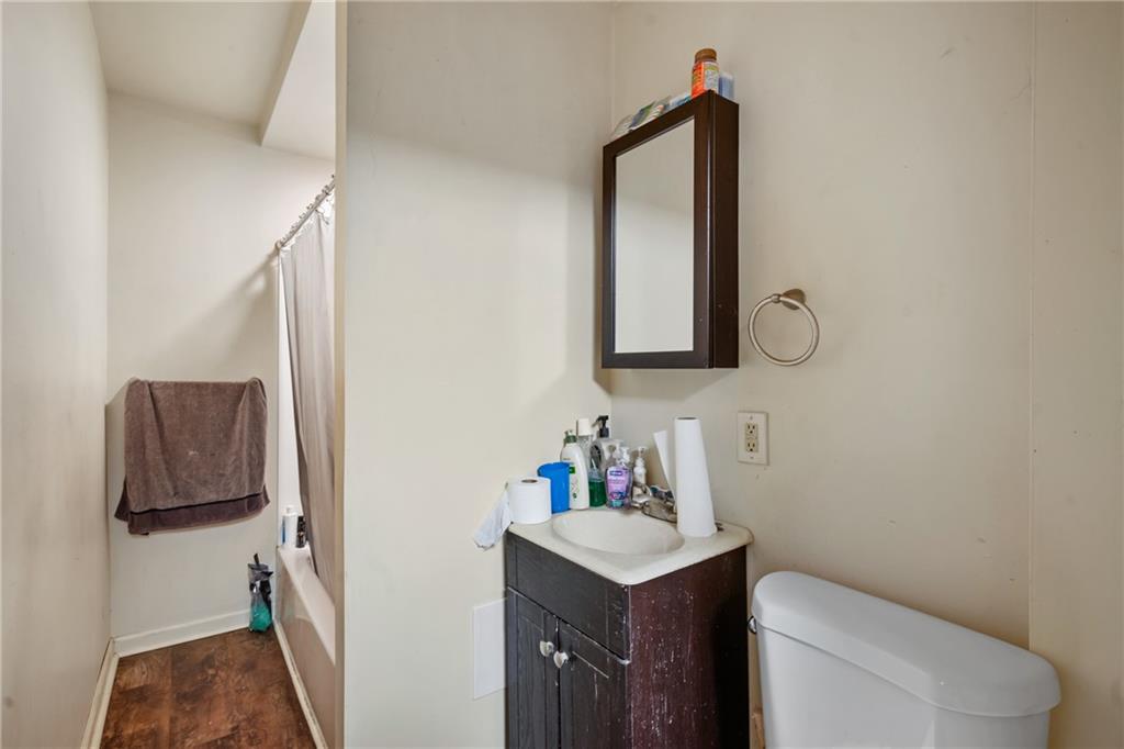 4974 Williamsport Road Elizabeth, PA 15037 - Photo 27 of 34 a bathroom with a toilet sink and mirror