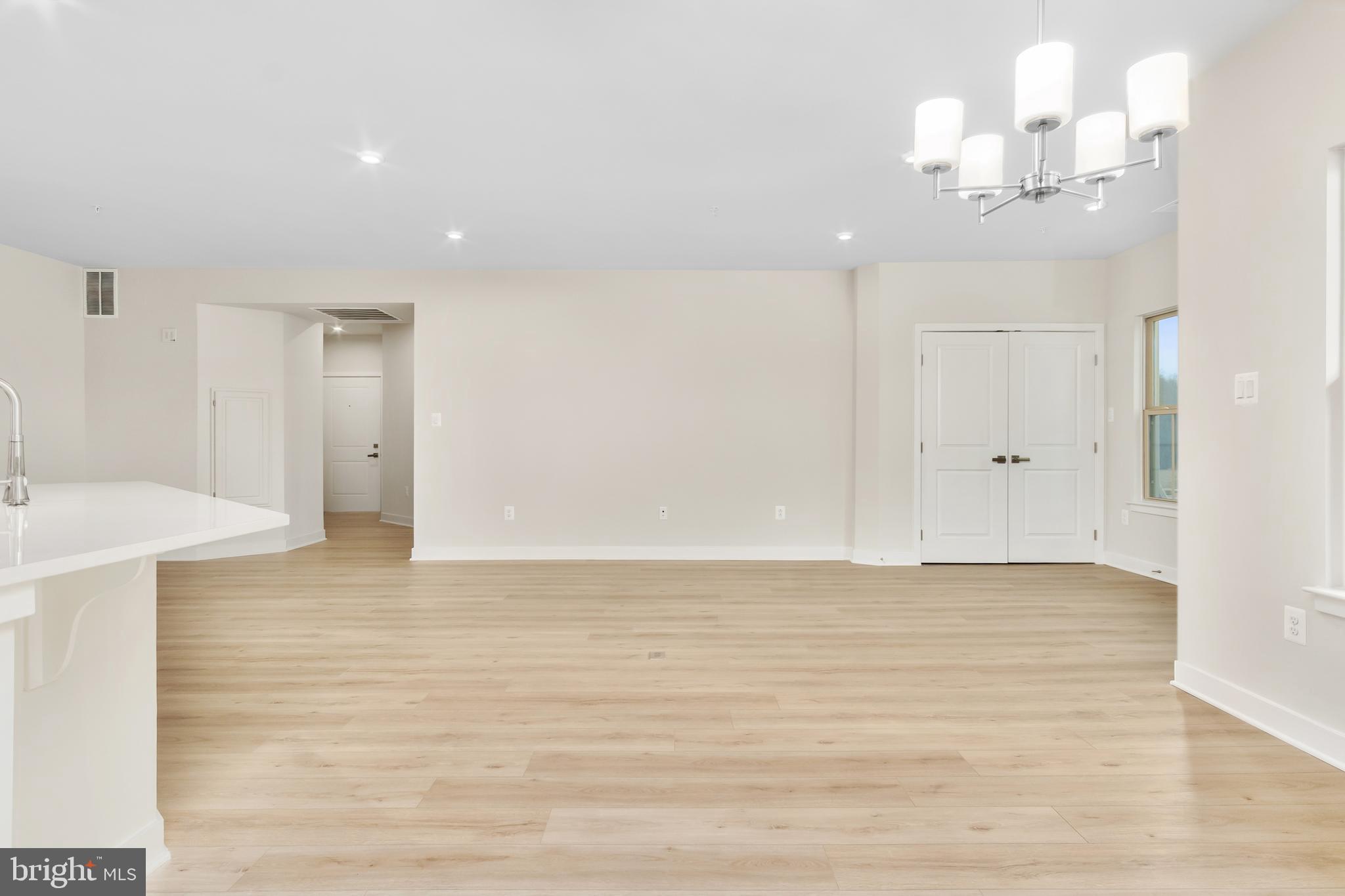 9935 Sofield Place, Unit 201 Frederick, MD 21701 - Photo 20 of 39 a view of a livingroom with an empty space