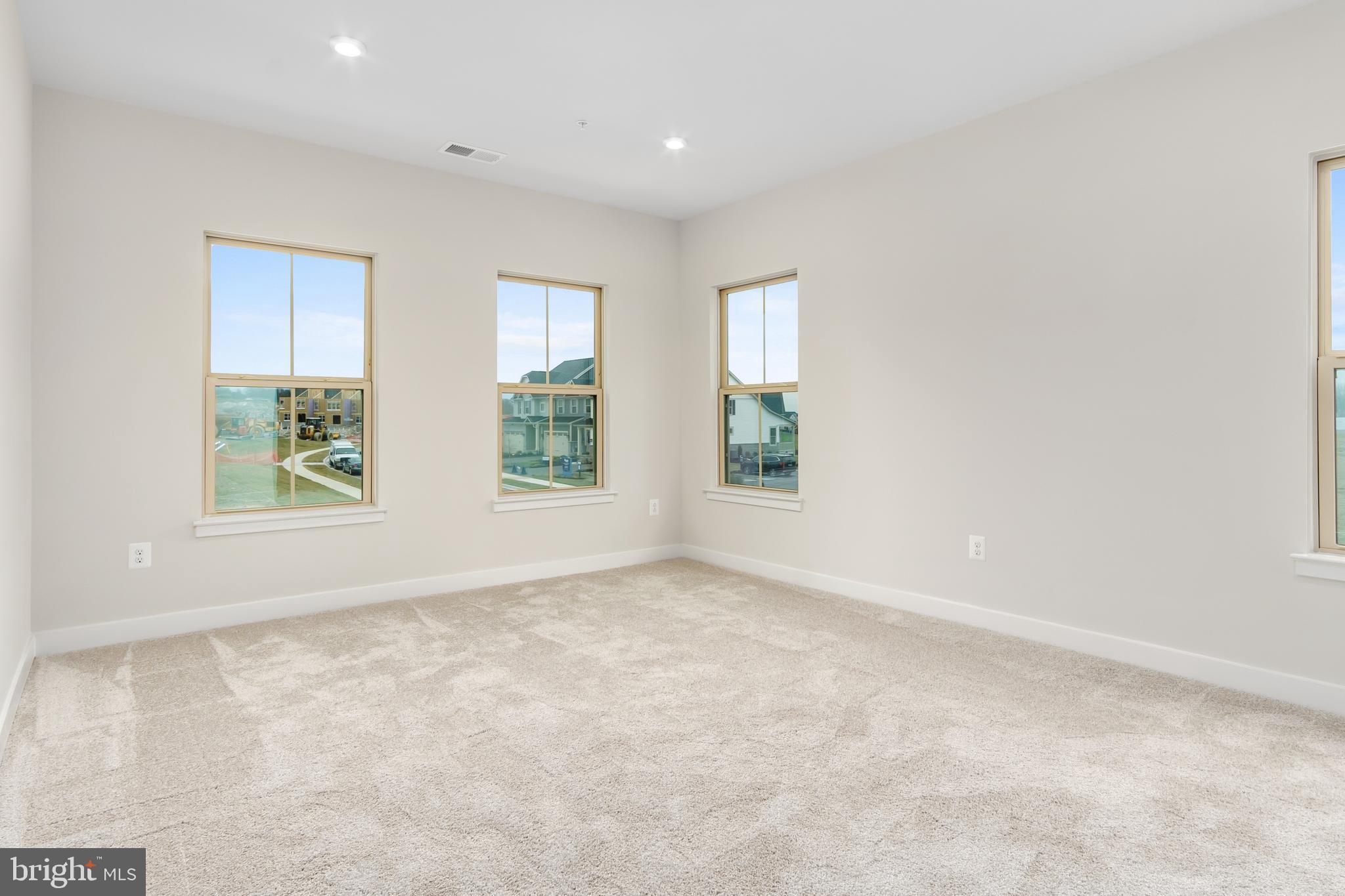 9935 Sofield Place, Unit 201 Frederick, MD 21701 - Photo 24 of 39 an empty room with windows