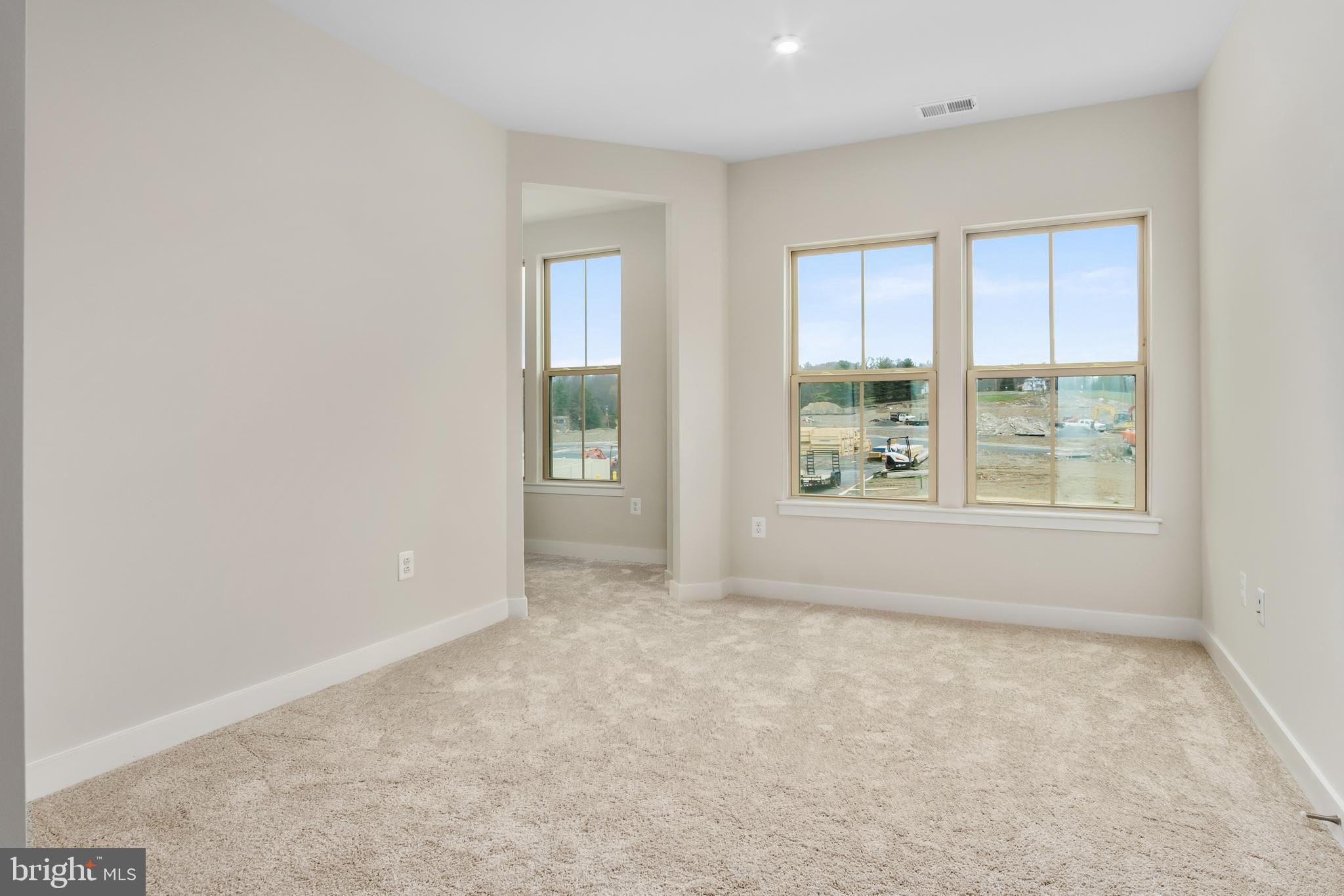 9935 Sofield Place, Unit 201 Frederick, MD 21701 - Photo 30 of 39 an empty room with windows