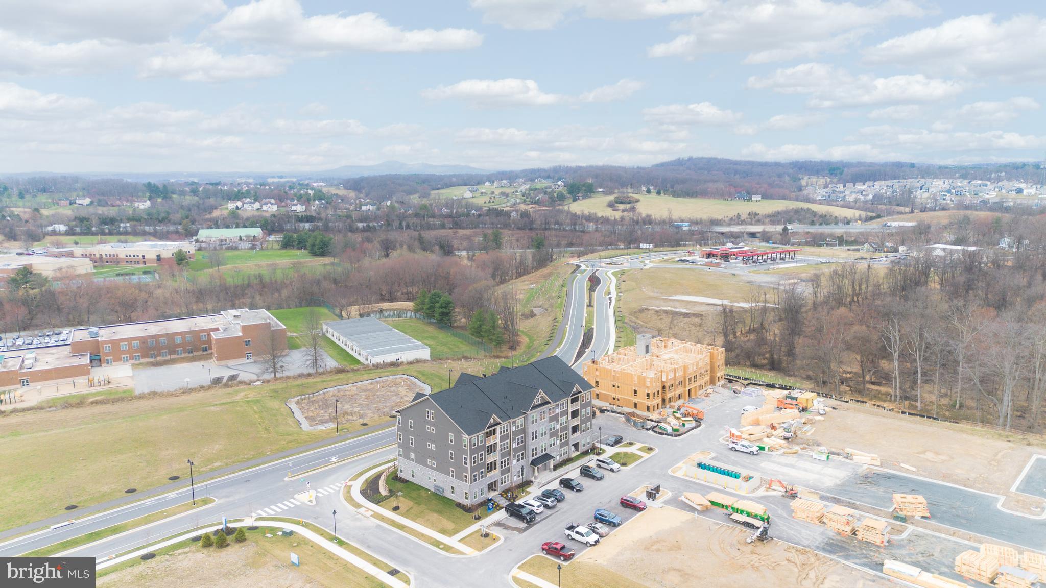 9935 Sofield Place, Unit 201 Frederick, MD 21701 - Photo 36 of 39 a view of a lake with a city