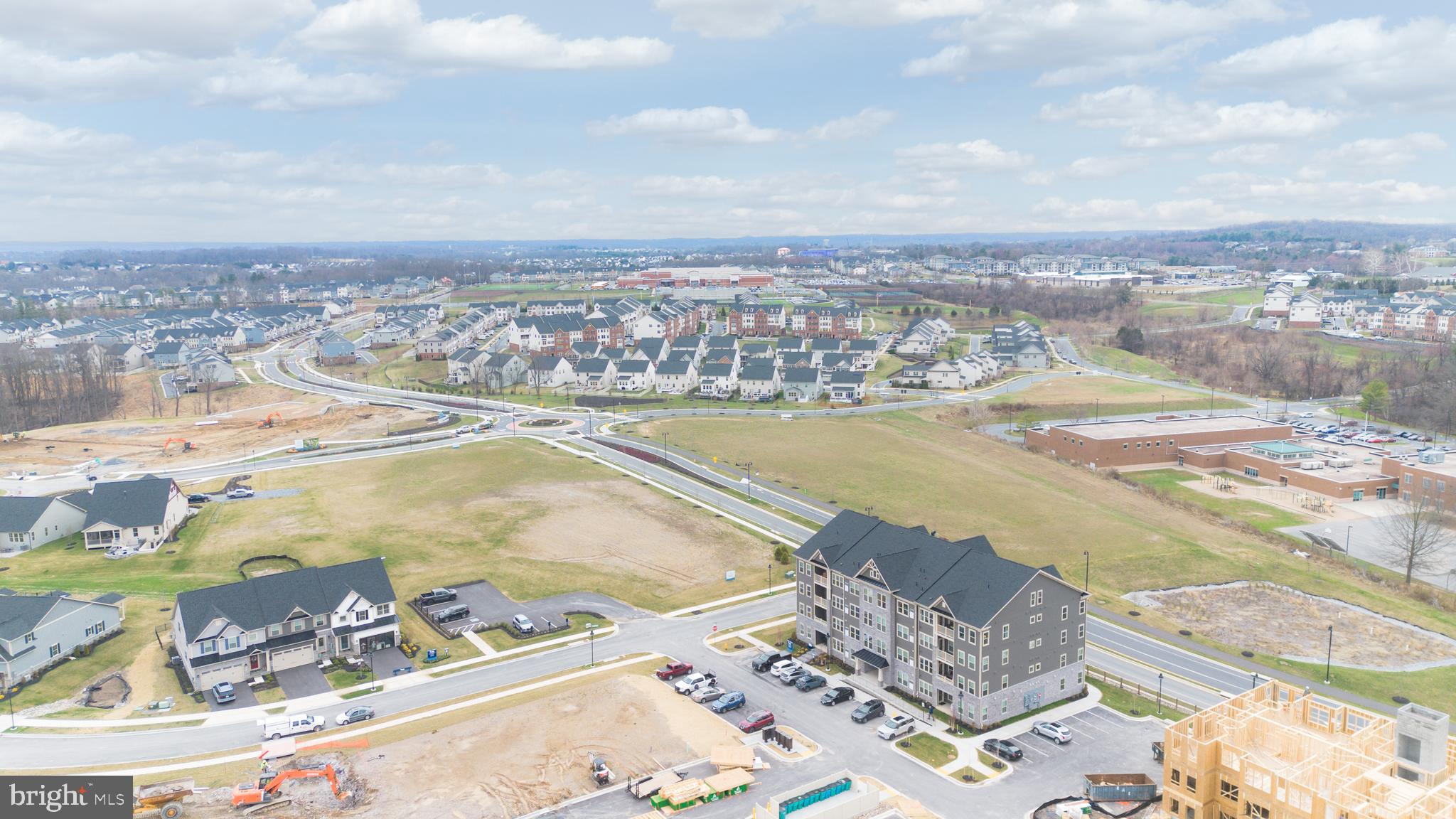 9935 Sofield Place, Unit 201 Frederick, MD 21701 - Photo 37 of 39 an aerial view of residential houses with outdoor space