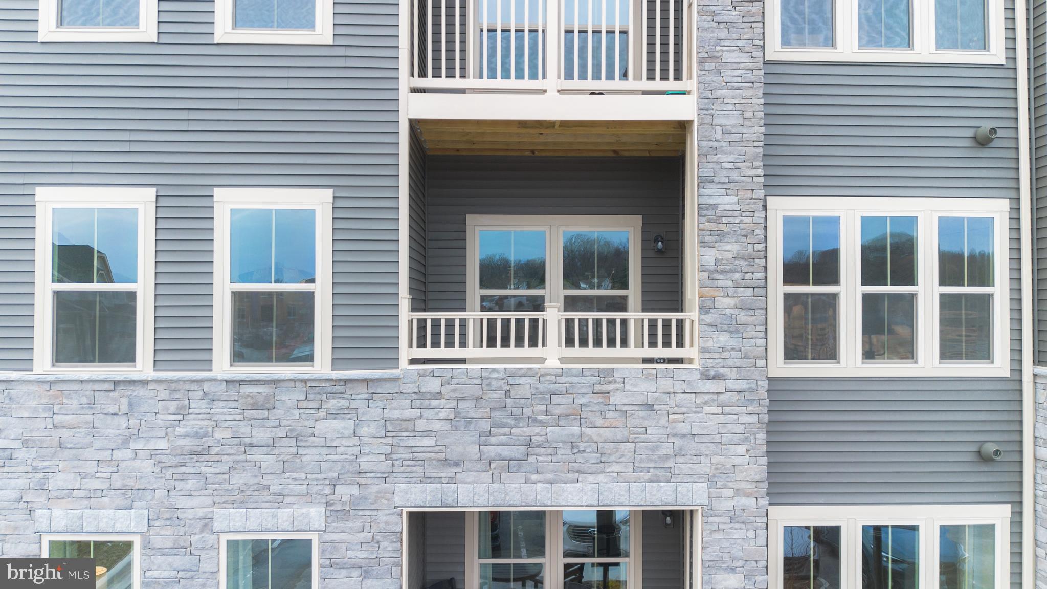9935 Sofield Place, Unit 201 Frederick, MD 21701 - Photo 4 of 39 a view of a brick house