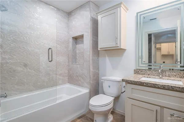 a bathroom with a sink toilet and bathtub