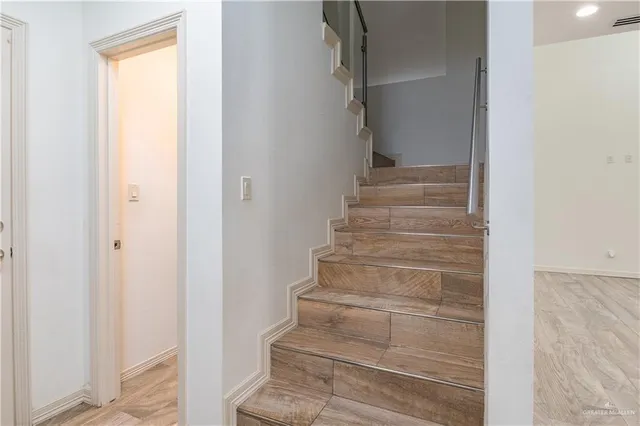 a view of staircase with white walls