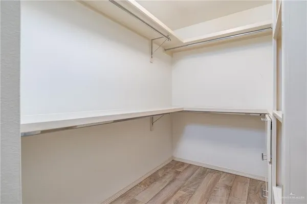 a view of an empty walk in closet