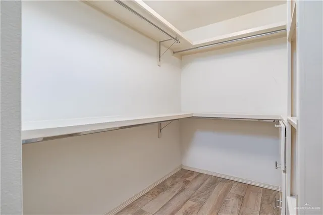 a view of an empty walk in closet