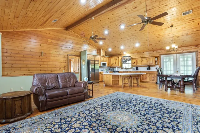 a large kitchen with a table and chairs